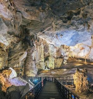 a staircase in a cavernous cave with rock formations