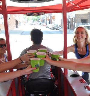a group of women holding up cups in a trolley