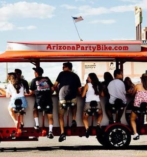 a group of people riding on a golf cart