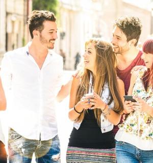 a group of people walking down the street