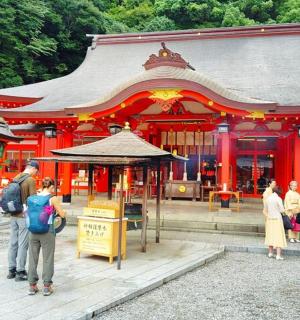 a group of people standing in front of a temple