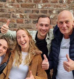 a group of people giving the thumbs up