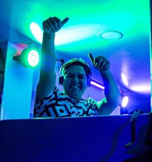 a man with his arms in the air with his hands up