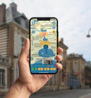 a person holding up a cell phone in their hand