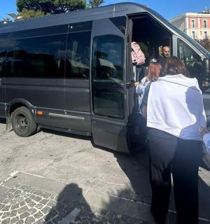 a group of people getting out of a van