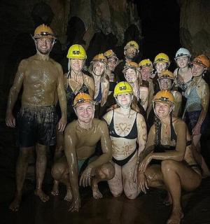 a group of people wearing hard hats posing for a picture