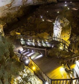 a cave with stairs and lights in a cave
