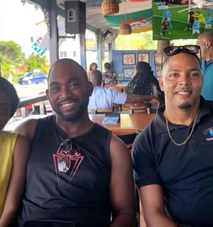 a group of three people posing for a picture