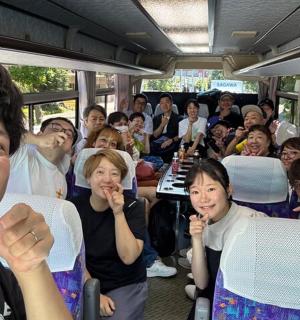 a group of people sitting on a bus