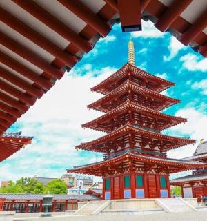a large building with a tower in front