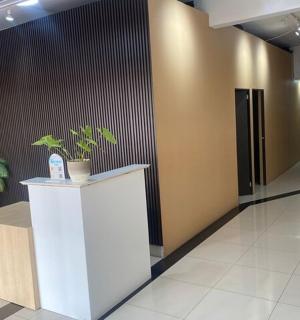 a lobby with a counter with a plant on it