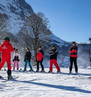 a group of people on skis in the snow