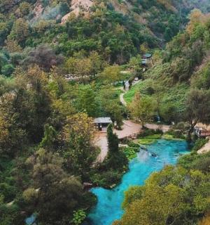 an aerial view of a river in a mountain
