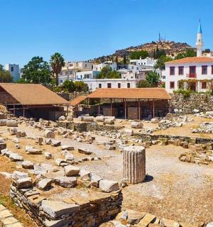a view of a city with ruins of a building