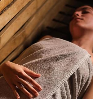 a woman with a towel on a wall