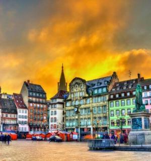 a painting of a city with a christmas tree