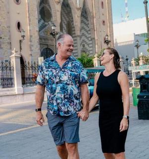 a man and a woman walking down a street