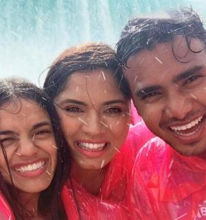 a group of three people in the rain