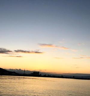 a sunset over a body of water