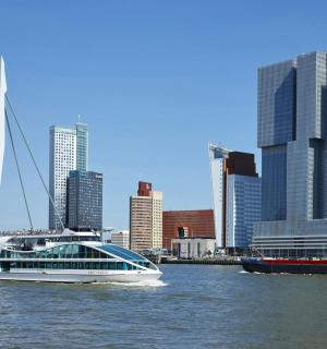 a large boat in the water with a bridge