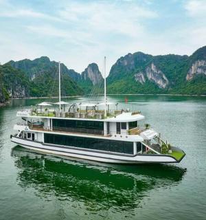 a boat on the water with mountains in the background