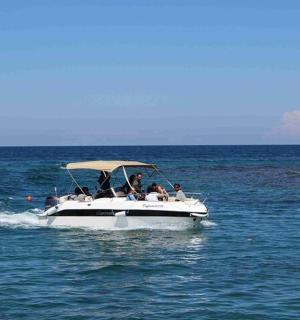 a group of people on a boat in the water