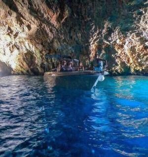 a group of people on a boat in a cave