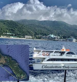 a boat on the water with mountains in the background