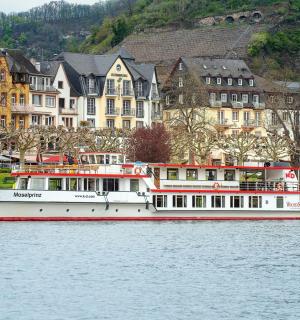a boat on the water in front of buildings