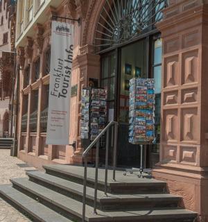 a building with stairs in front of a store