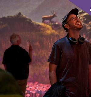 a man is standing in front of a picture