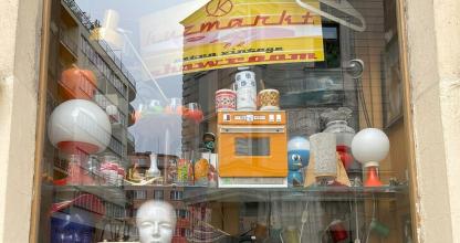 a store window with a lot of items on display