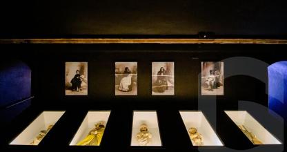 a display of figurines in a display case in a museum