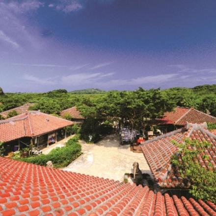 an overhead view of a house with red roofs