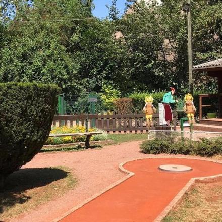 a garden with a park with people in the background