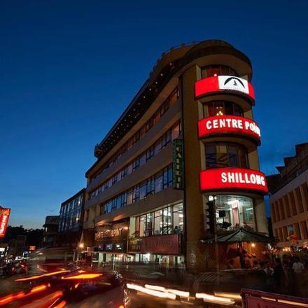 a building with a sign on it on a city street