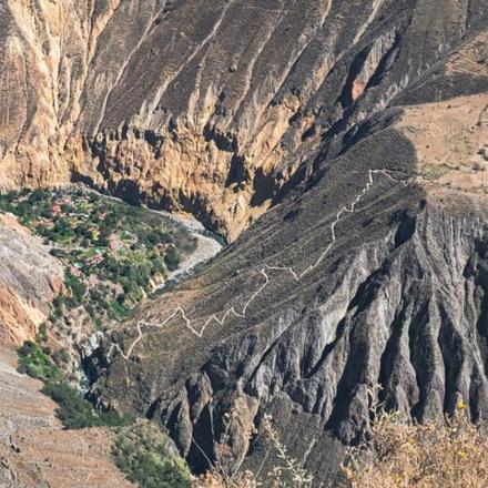 an aerial view of a mountain with a river