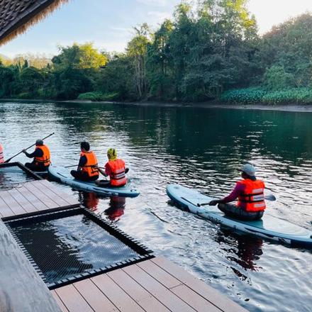 a group of people in kayaks on a river