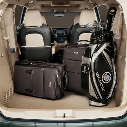 an open trunk of a car with luggage in it