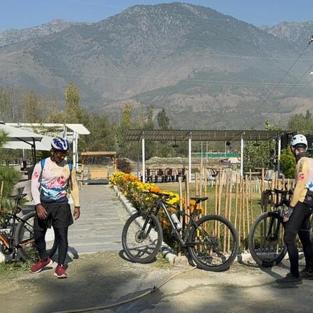 a group of people standing next to their bikes