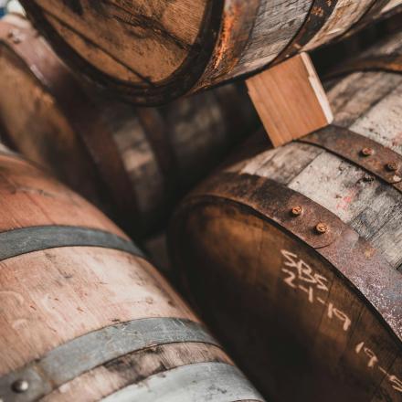 a pile of wooden barrels sitting next to each other