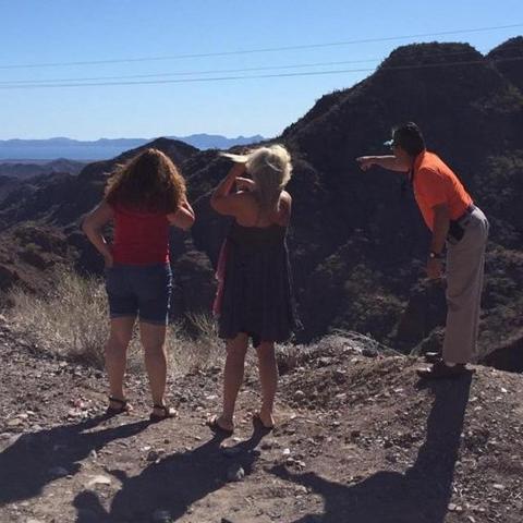 a group of people standing on top of a mountain