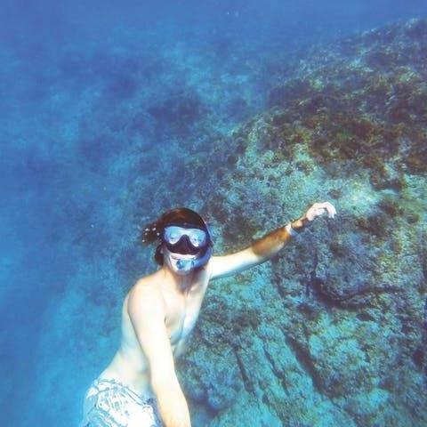 a woman in a mask is in the water