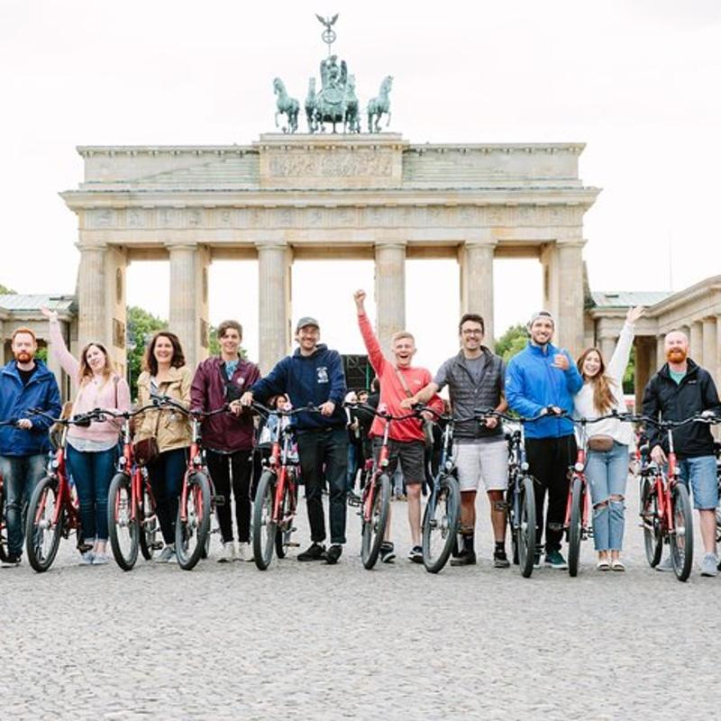 a group of people on bikes in front of a building