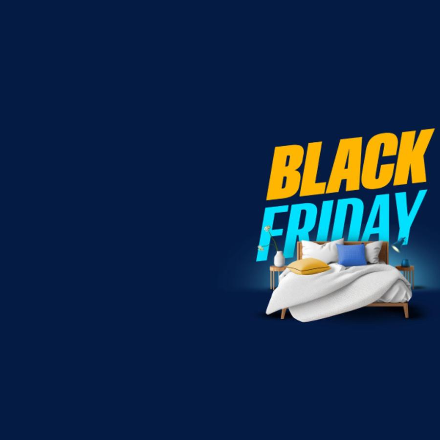A double bed in front of a large Black Friday logo