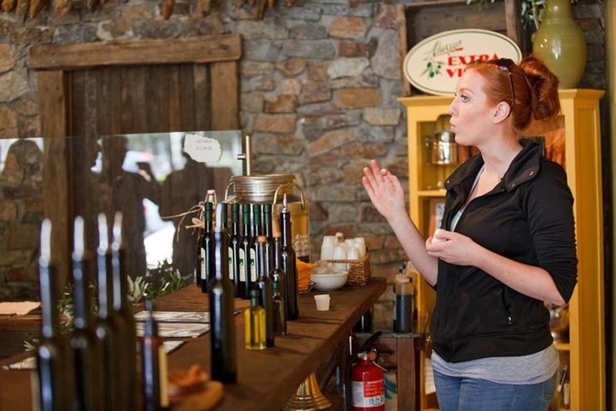 a woman standing next to a counter in a coffee shop