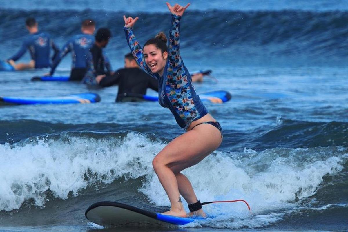 a woman riding a wave on a surfboard in the ocean