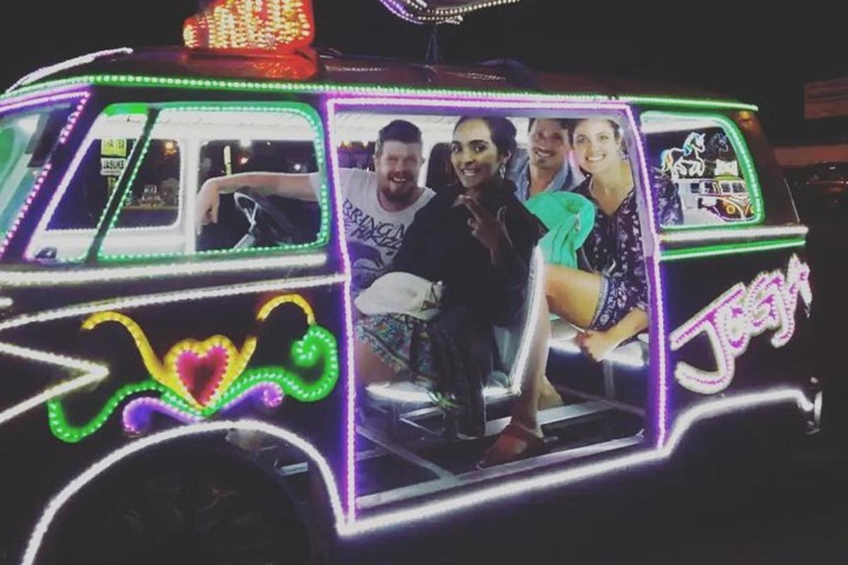 a group of people sitting inside of a van