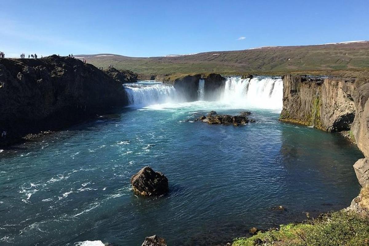 a waterfall in the middle of a river