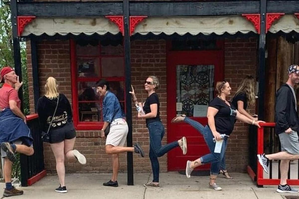 a group of people standing outside of a building